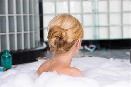 Woman taking a bubble bath Stock Photo - Premium Royalty-Free, Code: 6108-05873866