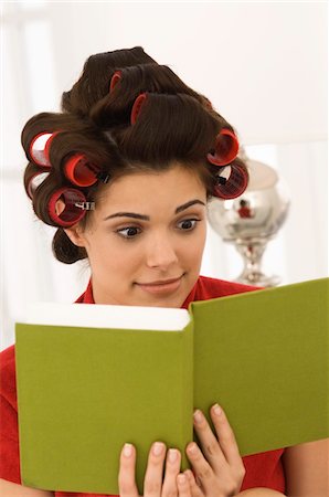 Close-up of a woman reading a book Stock Photo - Premium Royalty-Free, Code: 6108-05873811