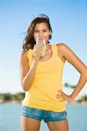 simsearch:6108-05861651,k - Portrait of a woman drinking lemonade Stock Photo - Premium Royalty-Free, Code: 6108-05874126