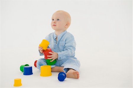 Baby boy stacking blocks Stock Photo - Premium Royalty-Free, Code: 6108-05874245