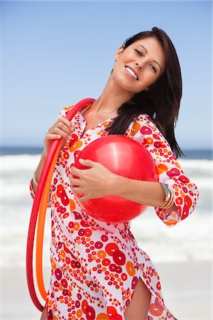 simsearch:6108-05872432,k - Portrait of a young woman carrying ball and plastic hoops Stock Photo - Premium Royalty-Free, Code: 6108-05874951