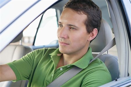 simsearch:6108-06906290,k - Mid adult man driving a car Stock Photo - Premium Royalty-Free, Code: 6108-05875061