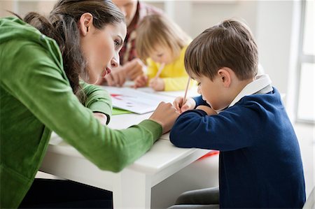simsearch:6108-06166629,k - Couple teaching their children at home Stock Photo - Premium Royalty-Free, Code: 6108-06166608