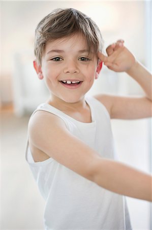 Portrait of a boy smiling Stock Photo - Premium Royalty-Free, Code: 6108-06166996