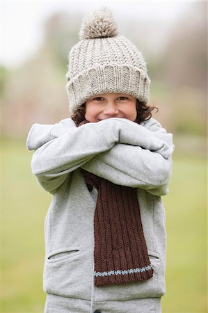 simsearch:6108-06167383,k - Portrait of a boy smiling in a field Stock Photo - Premium Royalty-Free, Code: 6108-06167013