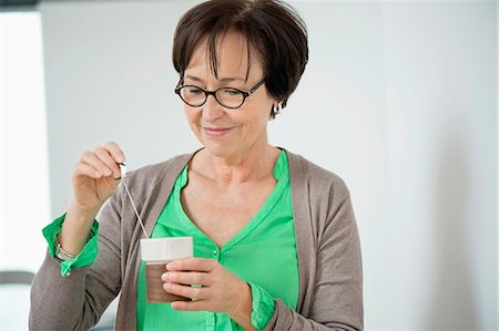 simsearch:6108-06167085,k - Close-up of a woman having coffee Stock Photo - Premium Royalty-Free, Code: 6108-06167114