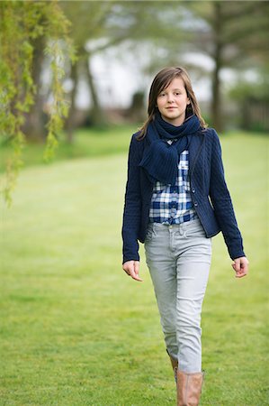 park child walk - Girl walking in a field Stock Photo - Premium Royalty-Free, Code: 6108-06167303