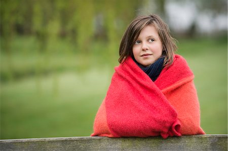 dreaming - Girl wrapped in a blanket and thinking in a farm Stock Photo - Premium Royalty-Free, Code: 6108-06167305