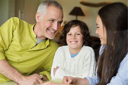 simsearch:6108-06167492,k - Close-up of a man with his children smiling Stock Photo - Premium Royalty-Free, Code: 6108-06167470