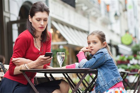 simsearch:6108-05873097,k - Woman with her daughter sitting in a cafe Stock Photo - Premium Royalty-Free, Code: 6108-06167583