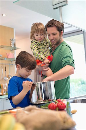 simsearch:6108-05869331,k - Man with his son and daughter in the kitchen Stock Photo - Premium Royalty-Free, Code: 6108-06167539