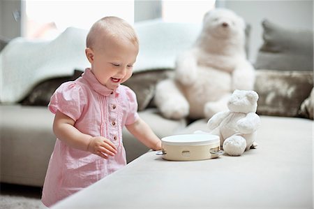 Baby girl playing with toys Stock Photo - Premium Royalty-Free, Code: 6108-06167672