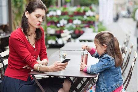 simsearch:6108-05873097,k - Woman with her daughter sitting in a cafe Stock Photo - Premium Royalty-Free, Code: 6108-06167605