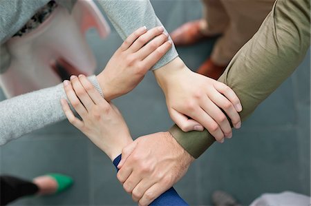 european union - Close-up of connecting hands of business executives Stock Photo - Premium Royalty-Free, Code: 6108-06167970