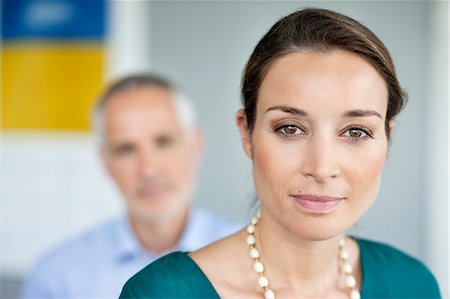 simsearch:6108-06167827,k - Portrait of a businesswoman in an office Stock Photo - Premium Royalty-Free, Code: 6108-06167990