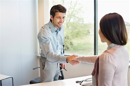 Business executive shaking hands with his client Stock Photo - Premium Royalty-Free, Code: 6108-06167933