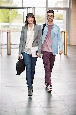 Business executives entering in an office lobby Foto de stock - Sin royalties Premium, Código: 6108-06168245