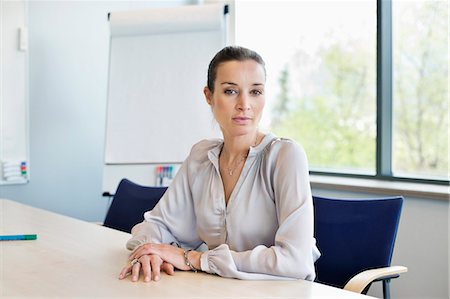 simsearch:6108-06167824,k - Portrait of a businesswoman in an office Stock Photo - Premium Royalty-Free, Code: 6108-06168338