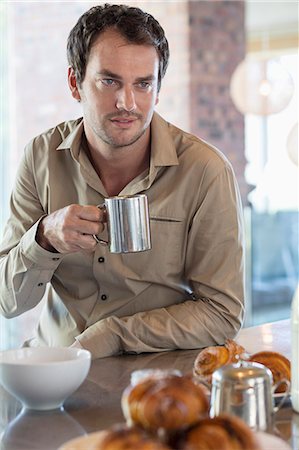 Man drinking tea in the kitchen Stock Photo - Premium Royalty-Free, Code: 6108-06904558