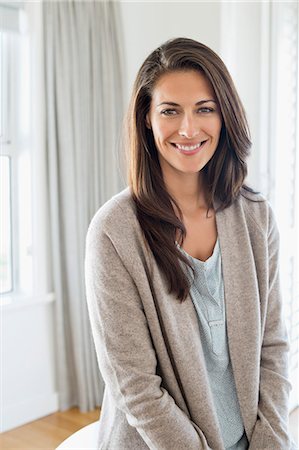Portrait of a woman smiling Stock Photo - Premium Royalty-Free, Code: 6108-06904530