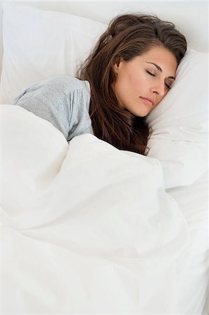 simsearch:693-03707745,k - Woman sleeping on the bed Stock Photo - Premium Royalty-Free, Code: 6108-06904757
