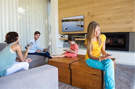 flatscreen - Family using electronics gadgets Stock Photo - Premium Royalty-Free, Code: 6108-06904889