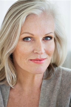 silver hair - Portrait of a woman smiling Stock Photo - Premium Royalty-Free, Code: 6108-06905059