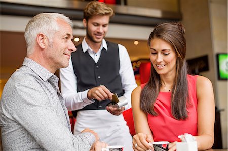 simsearch:6108-06907863,k - Couple paying with a credit card to a waiter in a restaurant Stock Photo - Premium Royalty-Free, Code: 6108-06905018