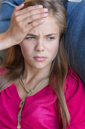 simsearch:6108-06905230,k - Close-up of a girl suffering from a headache Stock Photo - Premium Royalty-Free, Code: 6108-06905271