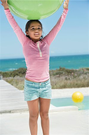 simsearch:6108-06907957,k - Girl holding a fitness ball on the beach Stock Photo - Premium Royalty-Free, Code: 6108-06905338