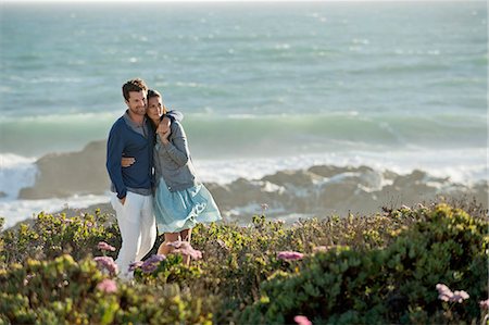 simsearch:6108-06907503,k - Couple standing on the beach Stock Photo - Premium Royalty-Free, Code: 6108-06905464