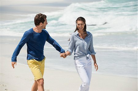 simsearch:6108-06907503,k - Couple enjoying on the beach Stock Photo - Premium Royalty-Free, Code: 6108-06905475