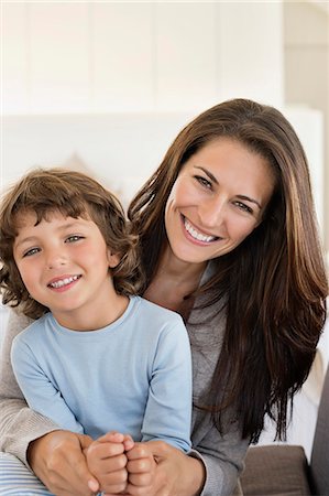 simsearch:6108-06907900,k - Portrait of a woman and her son smiling Stock Photo - Premium Royalty-Free, Code: 6108-06905562