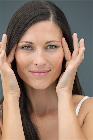 superficial - Portrait of a woman checking wrinkles on her face Stock Photo - Premium Royalty-Free, Code: 6108-06905513