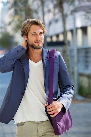 front street - Man walking on a street Stock Photo - Premium Royalty-Free, Code: 6108-06905665