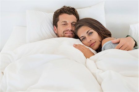 simsearch:6108-06907503,k - Portrait of a couple lying on the bed Stock Photo - Premium Royalty-Free, Code: 6108-06906226