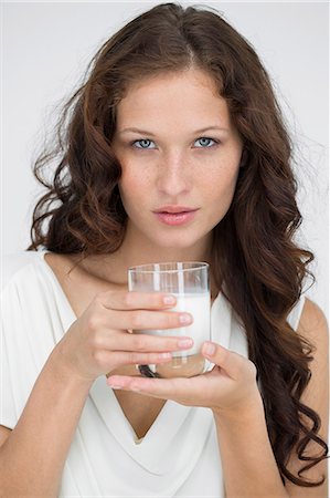 simsearch:6108-07969525,k - Portrait of a woman drinking milk Stock Photo - Premium Royalty-Free, Code: 6108-06906359