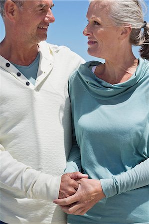 Senior couple smiling at each other Stock Photo - Premium Royalty-Free, Code: 6108-06906875