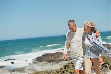 senior couple on beach - Couple walking on the beach Stock Photo - Premium Royalty-Free, Code: 6108-06906876