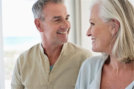 Smiling senior couple looking at each other Stock Photo - Premium Royalty-Free, Code: 6108-06906893