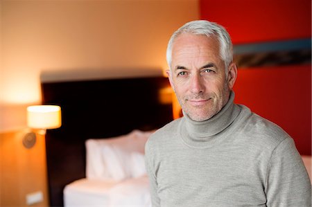 simsearch:6108-06907153,k - Portrait of a man in a hotel room Stock Photo - Premium Royalty-Free, Code: 6108-06907200