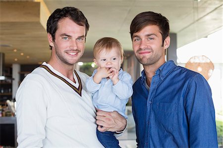 purity - Parents smiling with their son at home Stock Photo - Premium Royalty-Free, Code: 6108-06907351