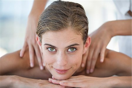 female smirk - Woman receiving back massage from a massage therapist Stock Photo - Premium Royalty-Free, Code: 6108-06907493