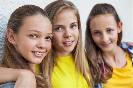 simsearch:6108-06907045,k - Three girls smiling together Stock Photo - Premium Royalty-Free, Code: 6108-06907674