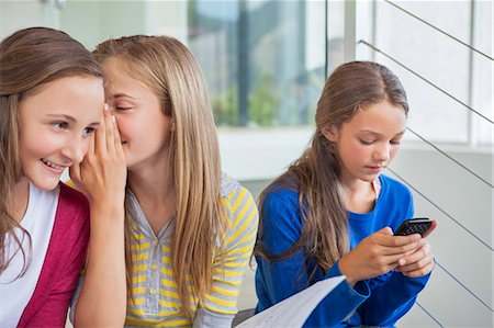 people gossiping - Students having fun in a school Stock Photo - Premium Royalty-Free, Code: 6108-06907702