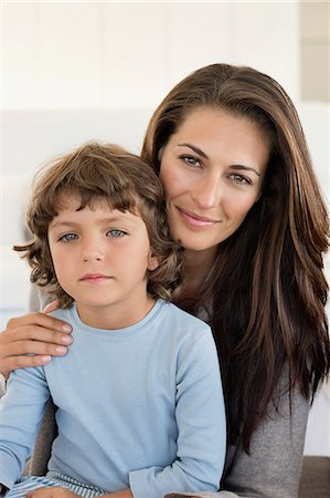 Portrait of a woman smiling with her son Stock Photo - Premium Royalty-Free, Code: 6108-06907897