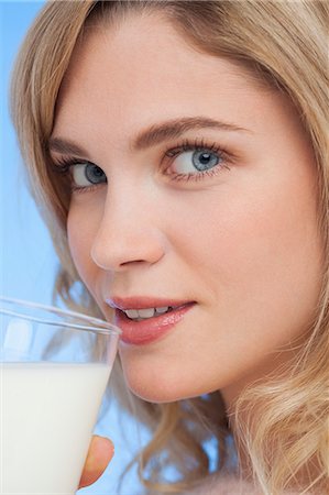 simsearch:6108-07969525,k - Close-up of a woman drinking milk Stock Photo - Premium Royalty-Free, Code: 6108-07969587