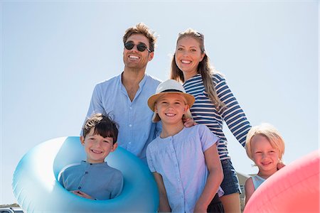 Portrait of a happy family enjoying on the beach Stock Photo - Premium Royalty-Free, Code: 6108-08662383