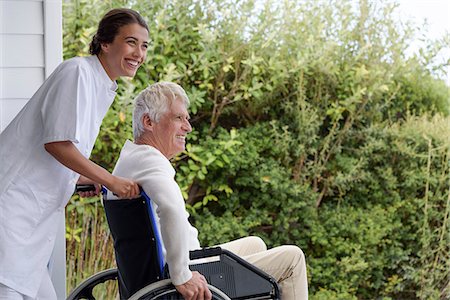 retired happy - Female nurse assisting senior man in wheelchair on porch Stock Photo - Premium Royalty-Free, Code: 6108-08662708