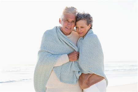 simsearch:649-07520161,k - Old couple embracing each other on the beach Stock Photo - Premium Royalty-Free, Code: 6108-08663044
